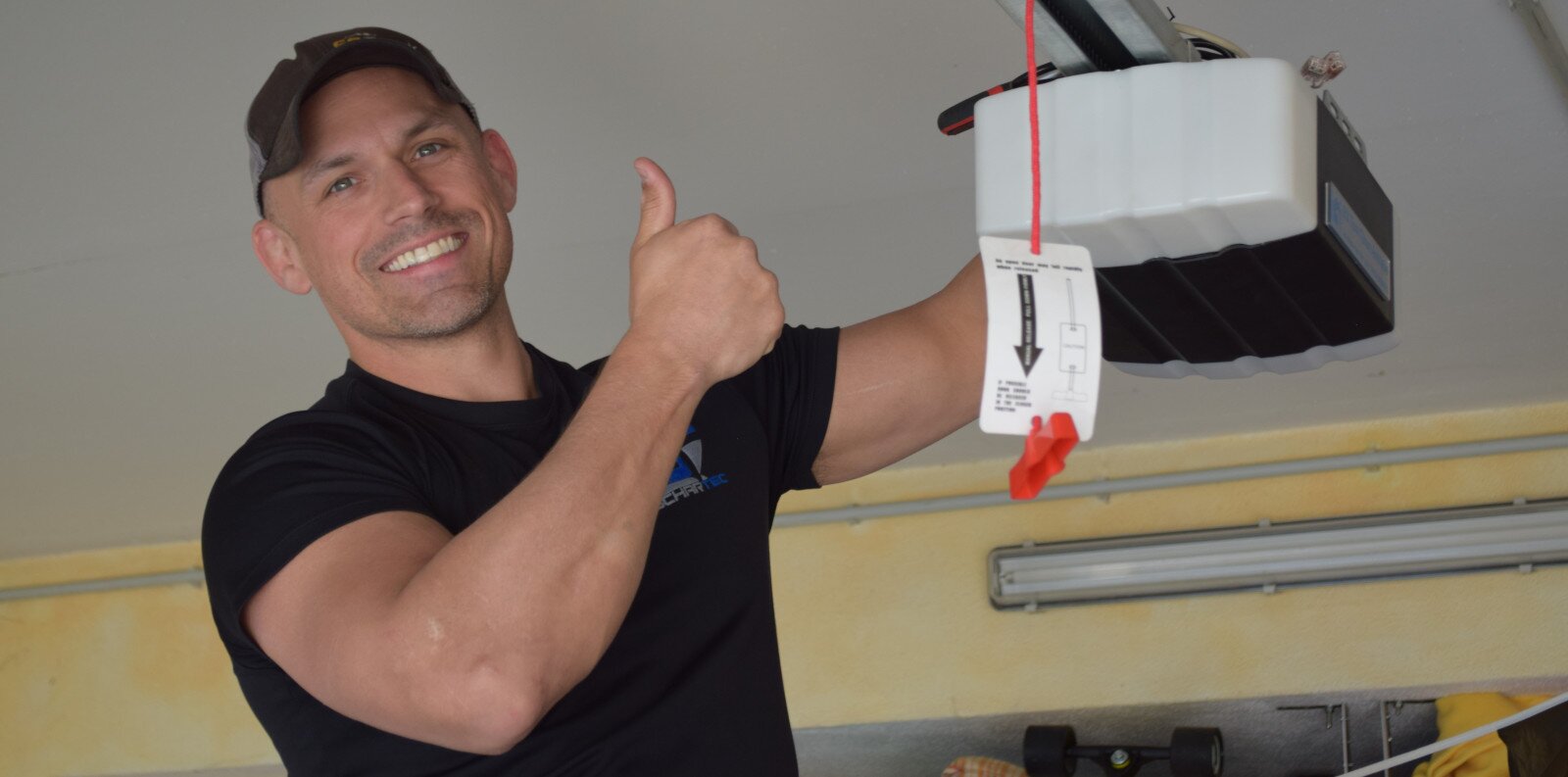 Founder and CEO Patrick Wilson with Schartec Garage Door Opener